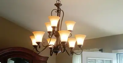 Classic ceiling chandelier installation with warm lighting in Ogden, UT