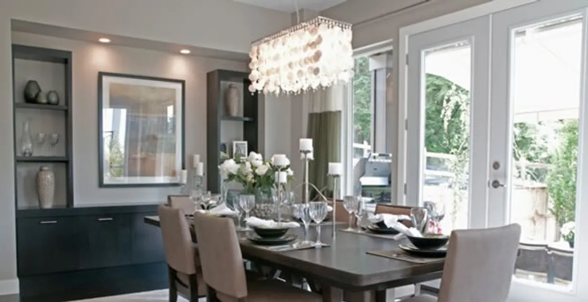 Elegant dining room chandelier installation above table in Ogden, UT