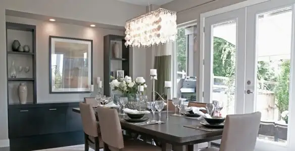 Elegant dining room chandelier installation above table in Ogden, UT