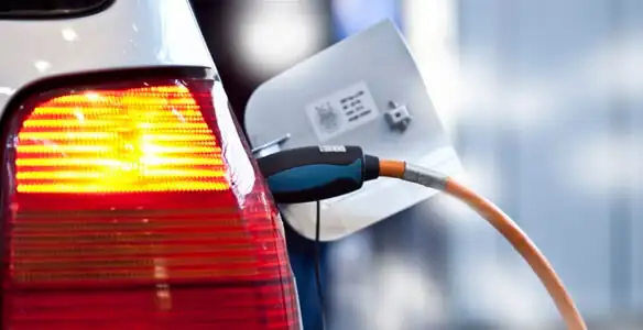 Electric car plugged into EV charger after professional installation in Ogden, UT