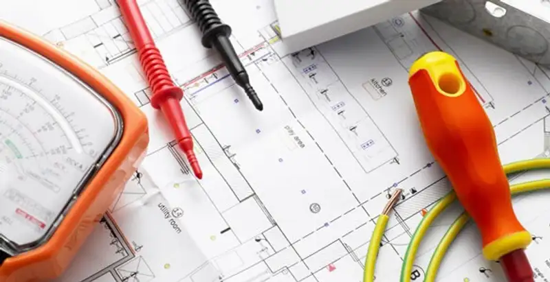licensed electrician planning and testing electrical systems using professional tools in Ogden, UT