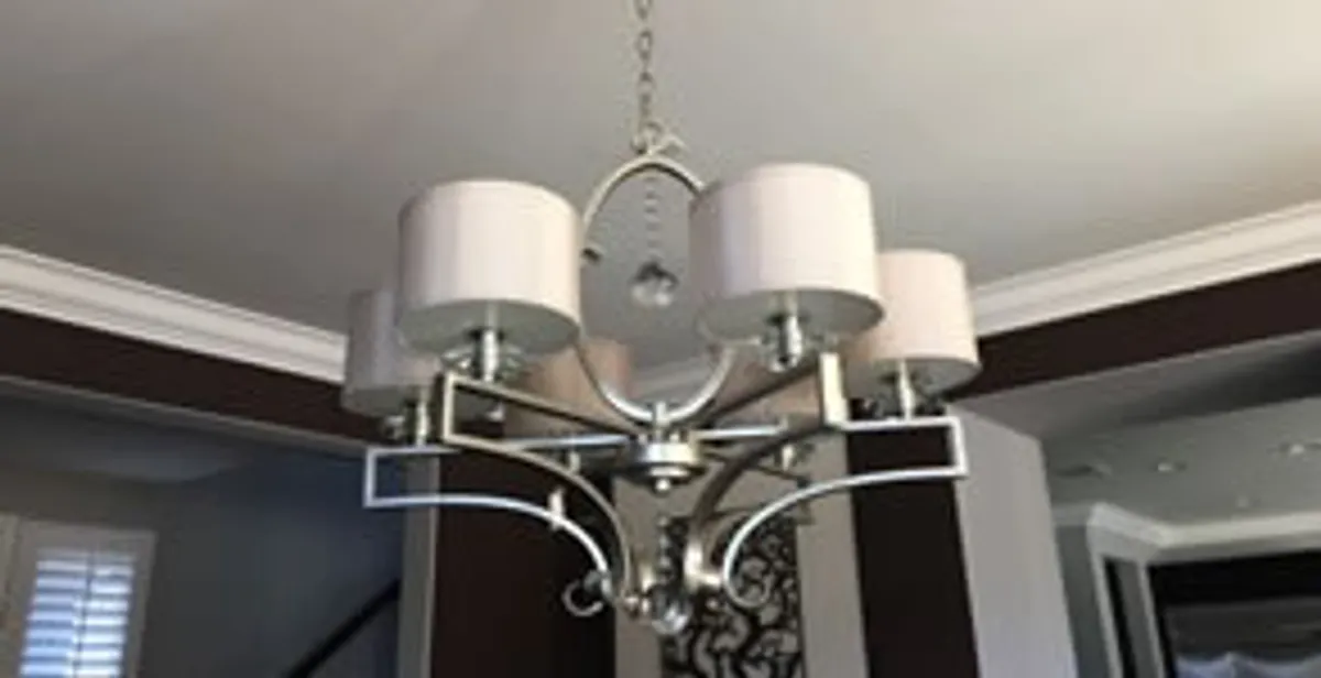 Modern chandelier installation with multiple light fixtures in Ogden, UT