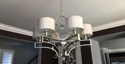 Modern chandelier installation with multiple light fixtures in Ogden, UT