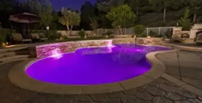 pool light installation and repair services illuminating a residential swimming pool in Ogden, UT