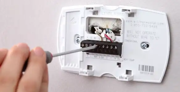Thermostat installation service with proper wiring and secure wall mounting in Ogden, UT